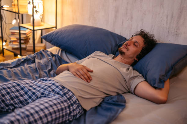 istock Mid-Adult Man Sleeping In The Bed At Night 2173096394