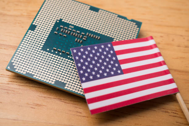 istock American flag on CPU computer (central processing unit) wooden background. 2173097061