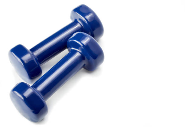 Small blue dumbbells, isolated in white background. Sports projectile for exercise.