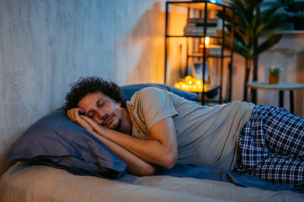 istock Mid-Adult Man Sleeping In The Bed At Night 2173098487