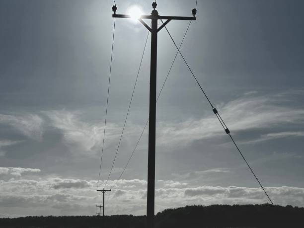 istock Silhouette of a telegraph pole on a sunny day 2173098919
