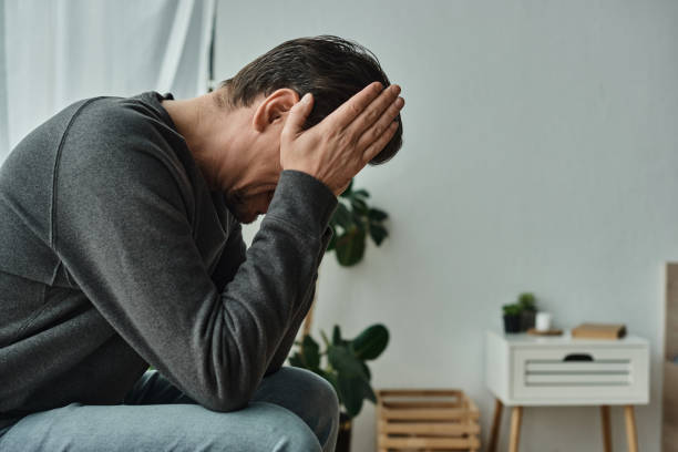 istock A thoughtful man relaxing at home, reflecting on life's complexities in a cozy setting 2173102330