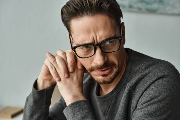 istock A thoughtful man enjoys a quiet moment at home while contemplating life and ideas 2173102890