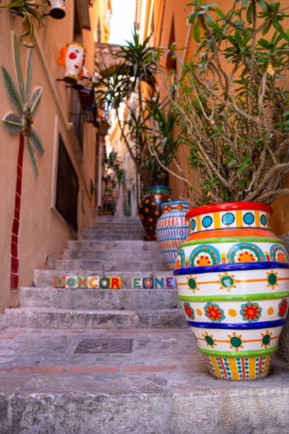 istock Potted plants in painted jars on staircase in Taormina,Sicily 2173107355