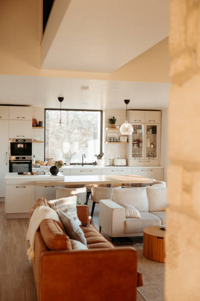 istock Modern open concept kitchen design with island featuring living room 2173110561