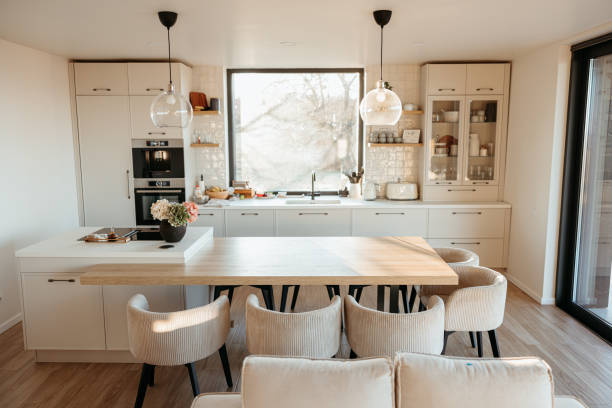 istock Modern scandinavian kitchen with island illuminated by morning sunlight 2173110565