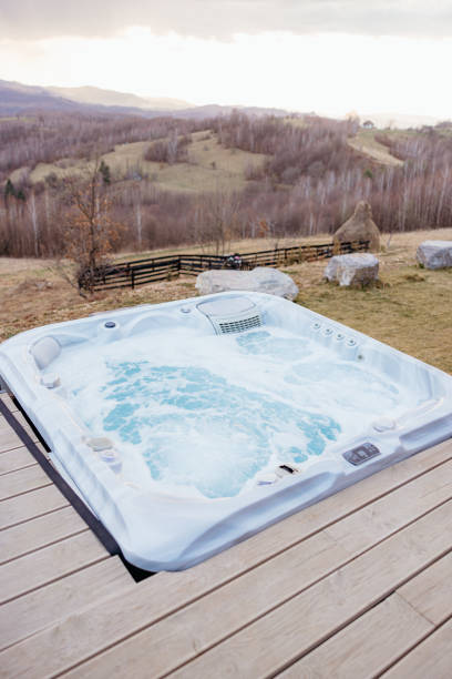 istock Steaming outdoor hot tub overlooking a serene mountain view 2173110772