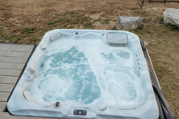istock Steaming outdoor hot tub awaiting on a cabin deck 2173110966