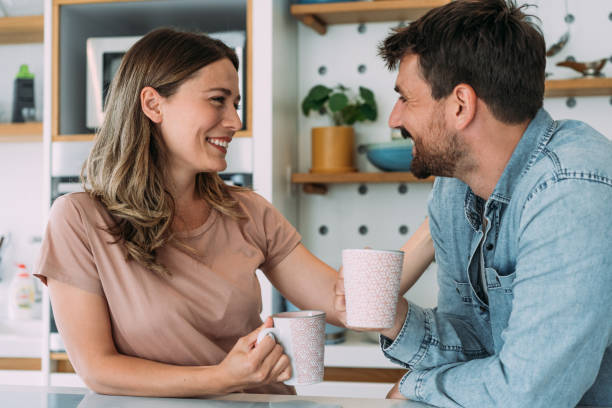 istock Lovely couple drinking coffee at home. 2173113646