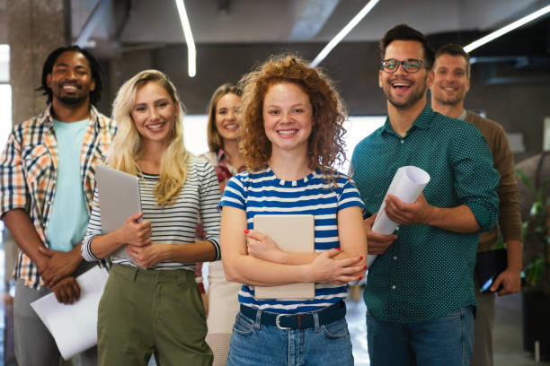 istock Group of young multi-ethnic startup business team collaborating on project in modern office 2173114289