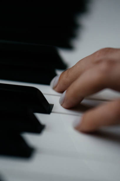 istock Piano keys person plays classical music black and white 2173118911