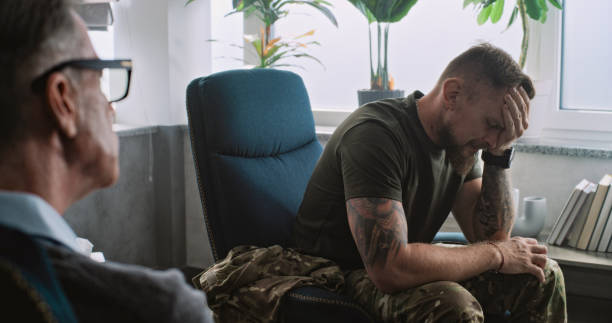 istock Military man with PTSD experiences negative emotions during therapy session 2173119329
