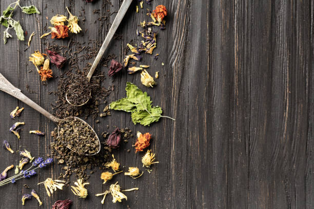 istock Dry green and black tea, flower tea on a dark background top view copy space. 2173120898
