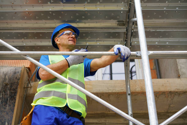 istock Construction worker on the scaffolding of a residential building under construction 2173121613