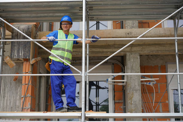 istock Construction worker on the scaffolding of a residential building under construction 2173121746
