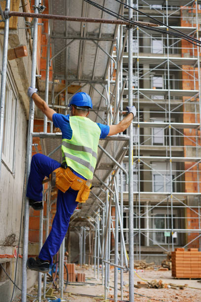 istock Construction worker on the scaffolding of a residential building under construction 2173121787