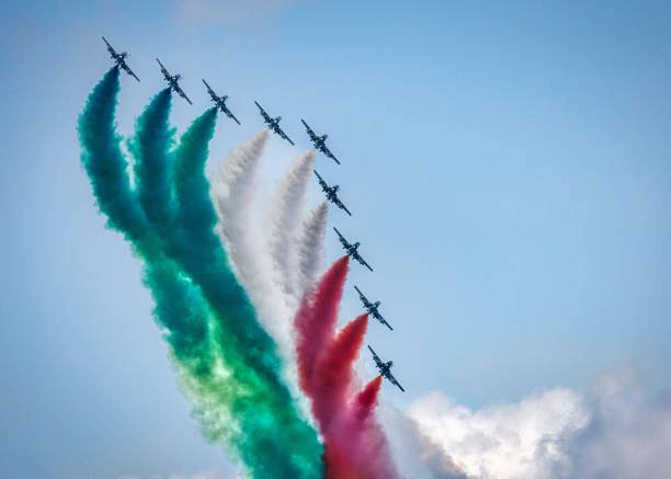 Virginia Beach, Virginia, USA - August 21, 2014: The Italian Air Force Frecce Tricolori Aerobatic Team trailing Italian flag colors in smoke at the 75th Anniversary of NATO Joint Power Demonstration.