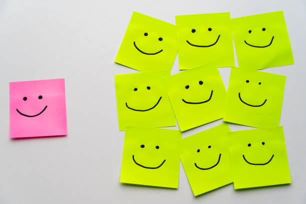 istock Sheets of paper with smiley faces drawn on them. 2173125951