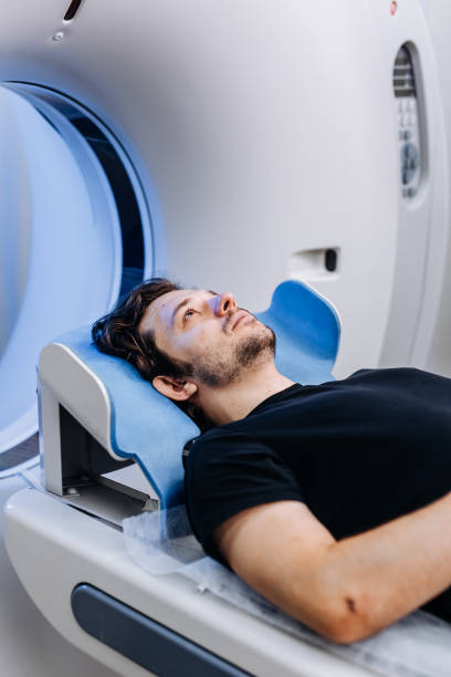 istock The patient lies inside an MRI or CT machine where the scan is performed. This high-tech equipment represents an innovation in diagnostics, providing accurate information for effective treatment. 2173126321