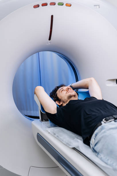 istock In a bright diagnostic center, a young man undergoes a CT or MRI scan using modern equipment. This image reflects the forefront of medical technology, emphasizing precision and patient care. 2173126387
