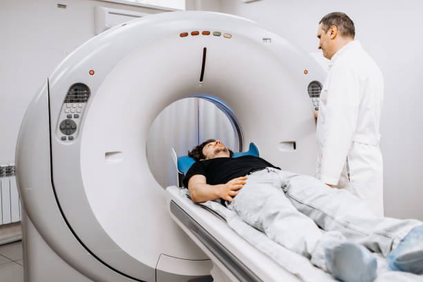istock In a bright diagnostic center, a young man undergoes a CT or MRI scan using modern equipment. This image reflects the forefront of medical technology, emphasizing precision and patient care. 2173126613