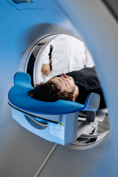 istock In a bright diagnostic center, a young man undergoes a CT or MRI scan using modern equipment. This image reflects the forefront of medical technology, emphasizing precision and patient care. 2173126665