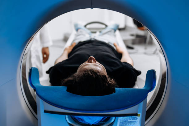 istock The patient lies inside an MRI or CT machine where the scan is performed. This high-tech equipment represents an innovation in diagnostics, providing accurate information for effective treatment. 2173126693