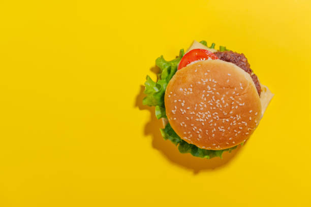 istock Hamburger spread evenly across a bright yellow background 2173127105