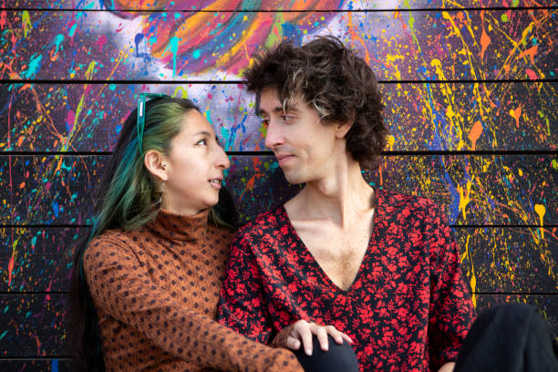 istock Portrait of non-binary friends in front of urban graffiti 2173133776