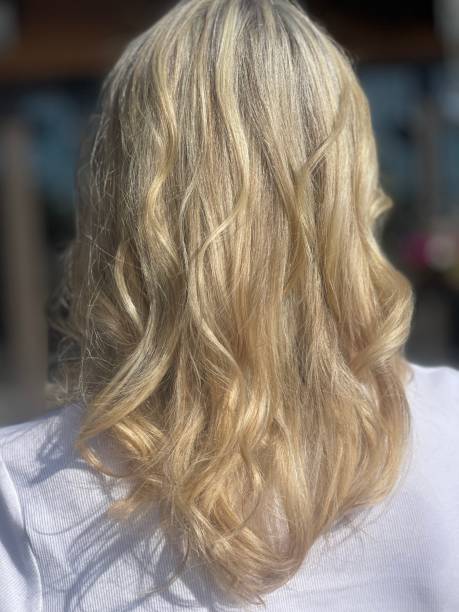 istock Long Blonde Highlighted Hair with curl 2173146688