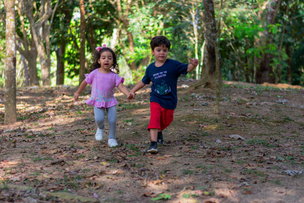 istock Children running and happy in the forest. 2173147053