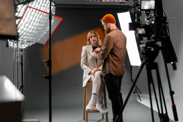 istock A man and woman chat on camera with stage equipment 2173151163