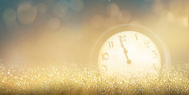 istock New Year's Eve motif with twelve o'clock dial and bokeh effect 2173151529