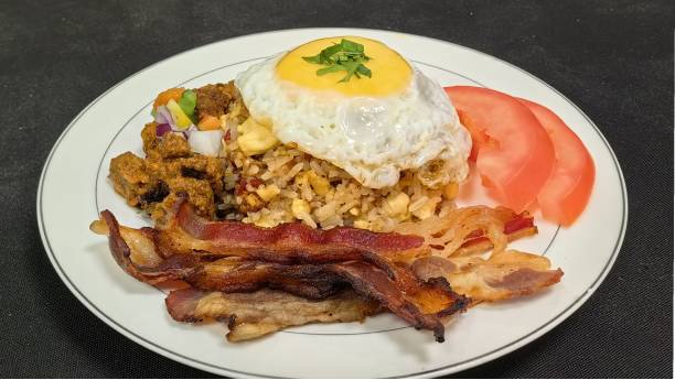istock Fried rice served with sunny side up and beef bacon. 2173158706