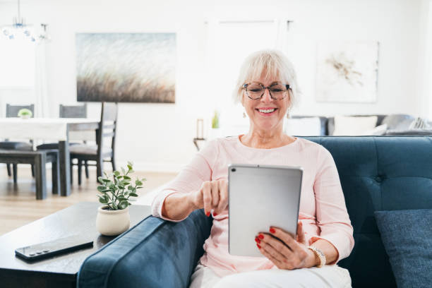 istock Senior woman using digital tablet at home 2173160550
