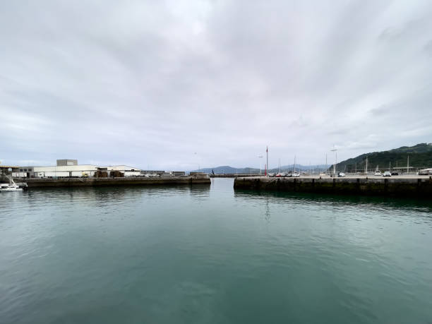 istock scene with calm waters reflecting the overcast sky 2173161507