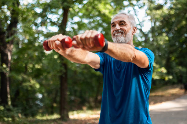 istock : Senior Man Lifting Weights in the Park 2173163207