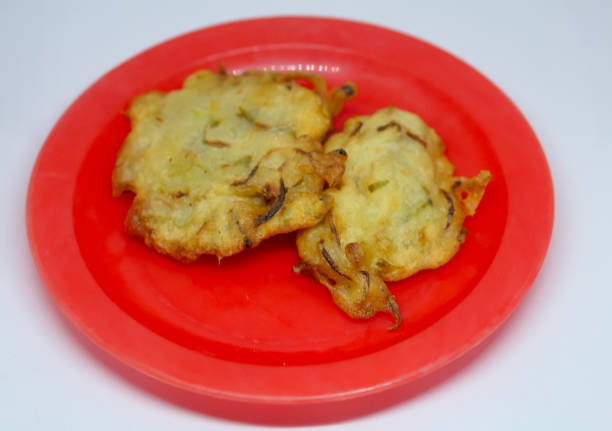 fried bakwan food served on a red plate