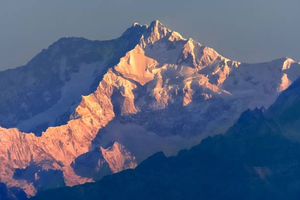 istock Beautiful first light from sunrise on Mount Kanchenjugha, Himalayan mountain range, Sikkim, India. Orange tint on the mountains at dawn 2173172028