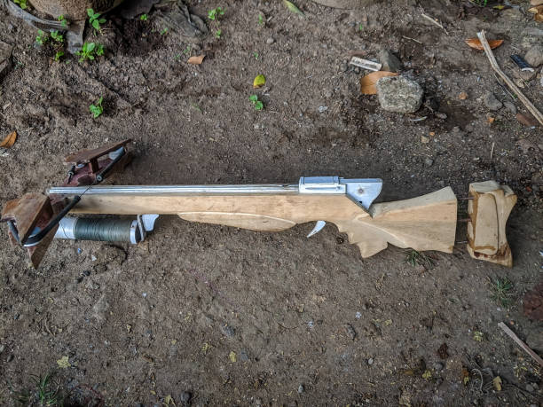 istock A handcrafted wooden crossbow with a visible string and trigger mechanism 2173172628