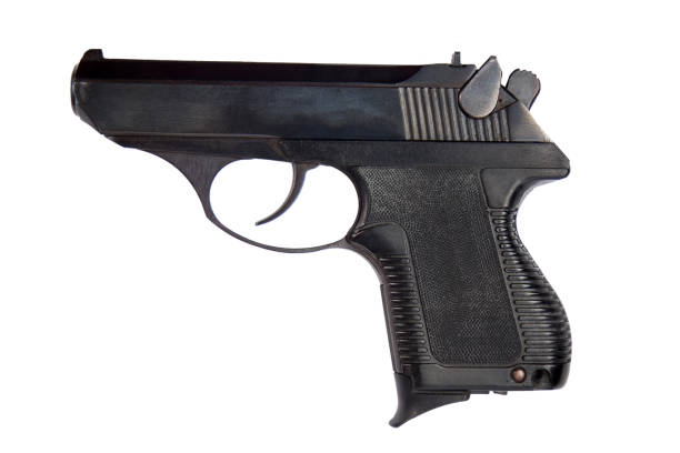 Black gun isolated on white background with clipping path. Side view.