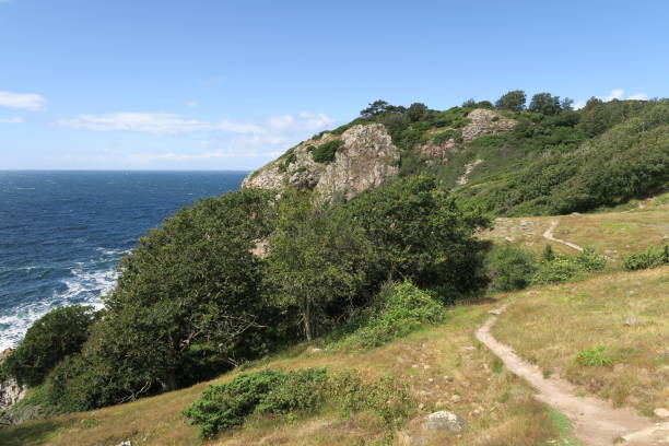 There is a hiking trail on the cliffs on the Kullaberg on the Kullen peninsula. Waves of the Öresund are crashing on the rocks. It's part of the Swedish region Scania.