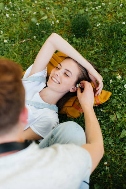 istock Young people lying on the grass and hanging out 2173196892