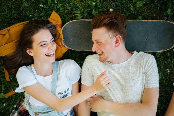istock Young people lying on the grass and hanging out 2173197100