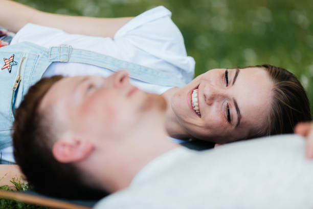 istock Young people lying on the grass and hanging out 2173197123