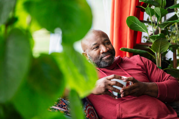 istock Mature multiracial man relaxing at home, drinking tea 2173201515