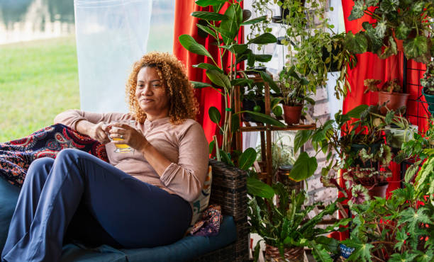 istock Mature multiracial woman relaxing at home, drinking tea 2173201782
