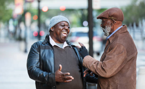 istock Senior African-American man laughs talking with friend 2173201917
