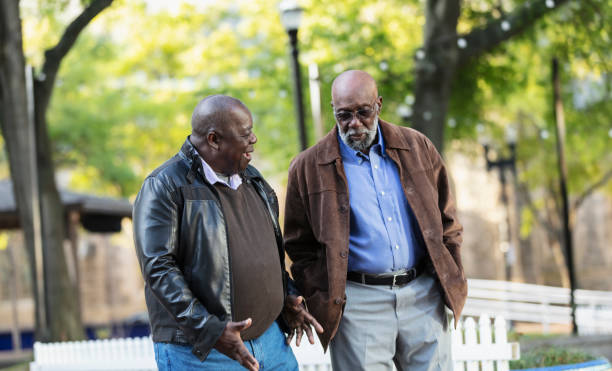 istock Two senior African-American men talking in city park 2173201934