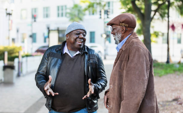 istock Two senior African-American men talking in city park 2173201940